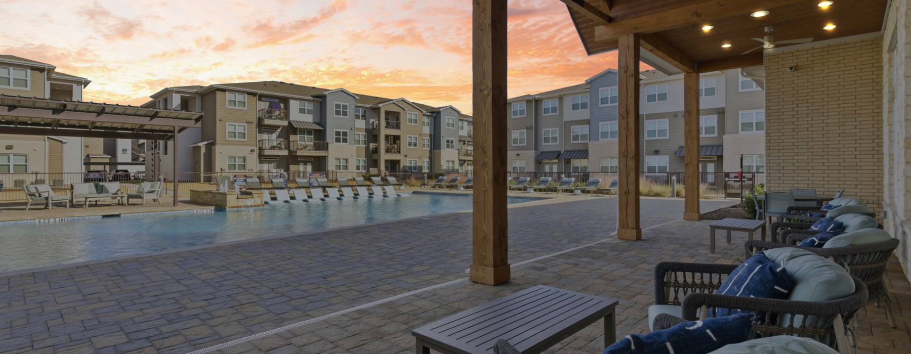 Covered patio seating outside community clubhouse